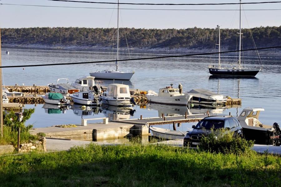 a bunch of boats are docked in the water at Apartmani Kordić in Barbat na Rabu