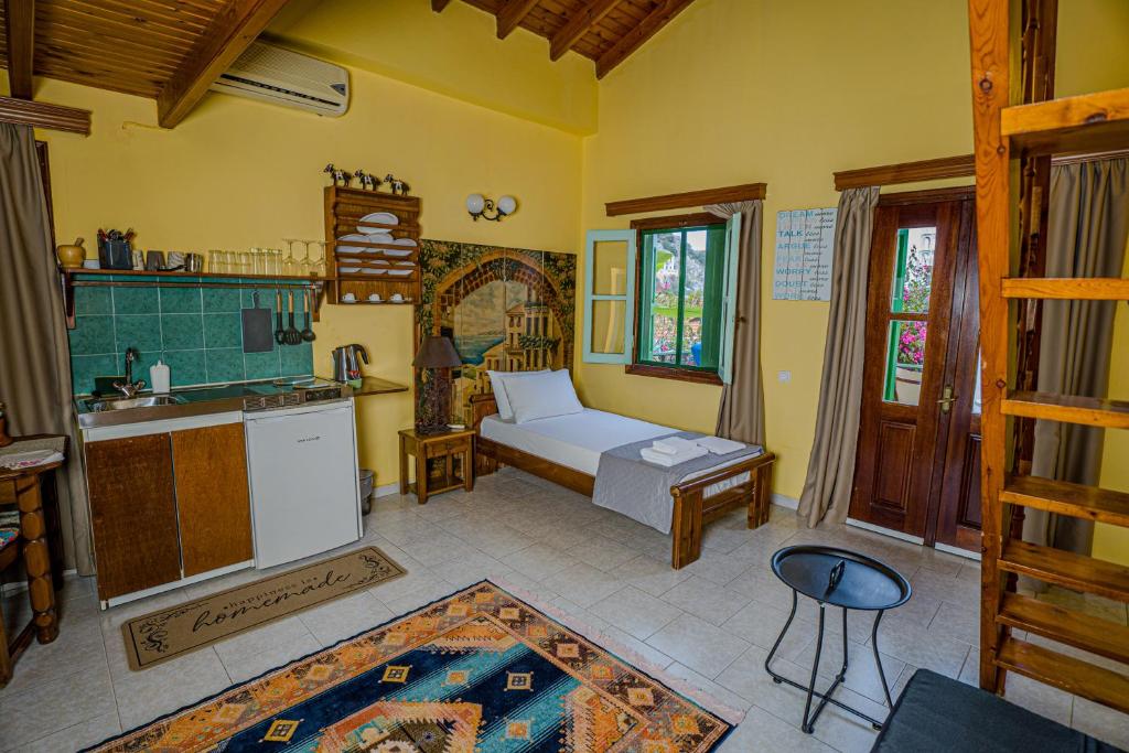 Postel nebo postele na pokoji v ubytování Symi Garden Studios