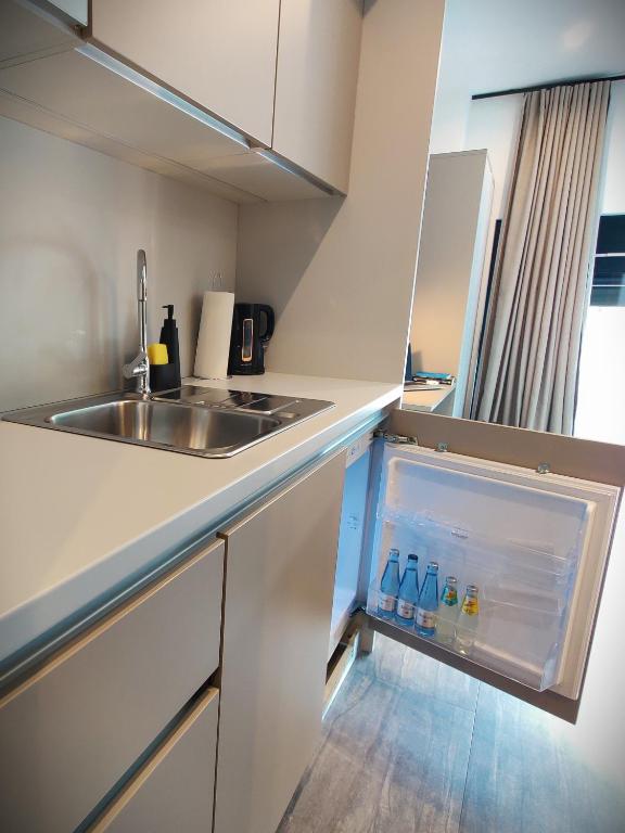 Kuchyň nebo kuchyňský kout v ubytování NOVERA Aparthotel