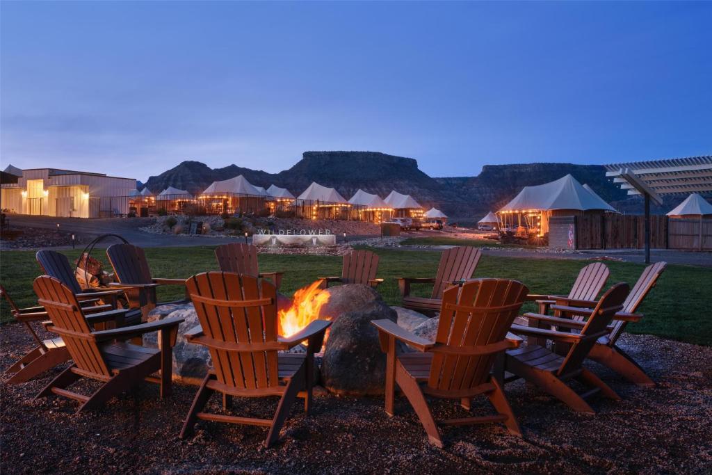 a group of chairs sitting around a fire pit at Zion Wildflower Resort, WorldHotels Backdrop in Virgin