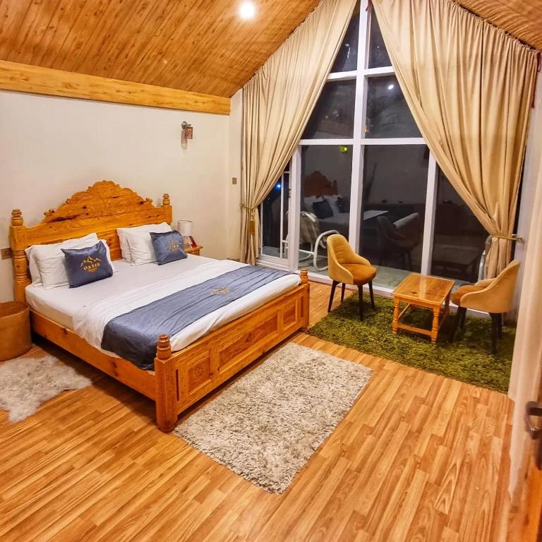 Postel nebo postele na pokoji v ubytování Oasis Resort
