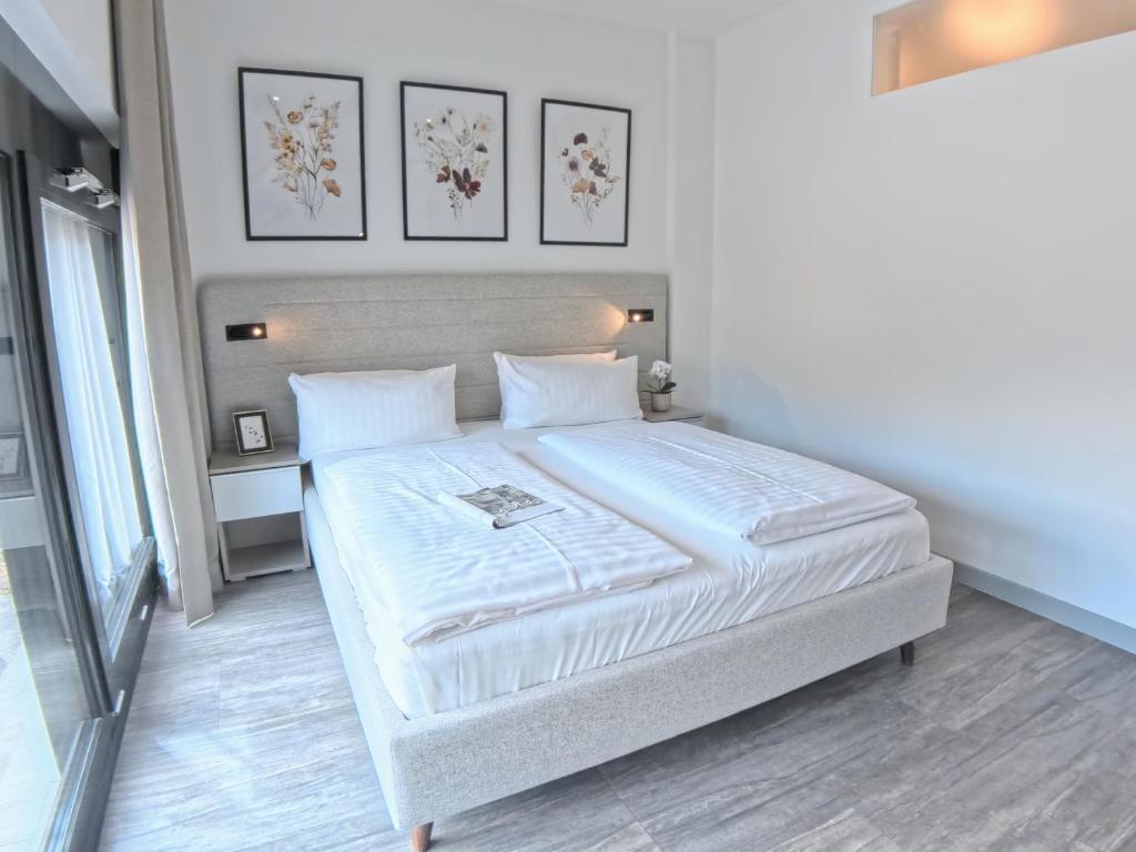 Postel nebo postele na pokoji v ubytování NOVERA Aparthotel