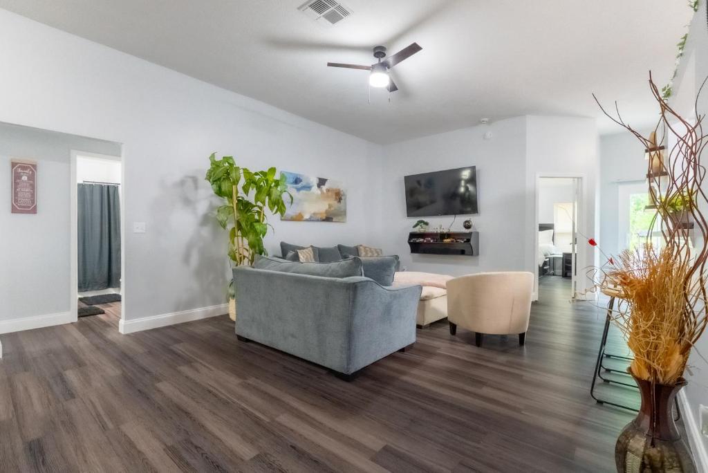 a living room with a couch and a table at Family Retreat Near NAS JAX and Orang Park Mall with Gameroom in Jacksonville