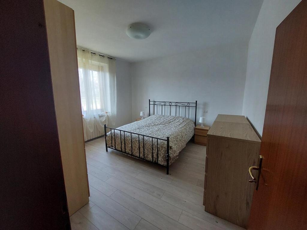 Ένα ή περισσότερα κρεβάτια σε δωμάτιο στο Casa Rossi Family Home