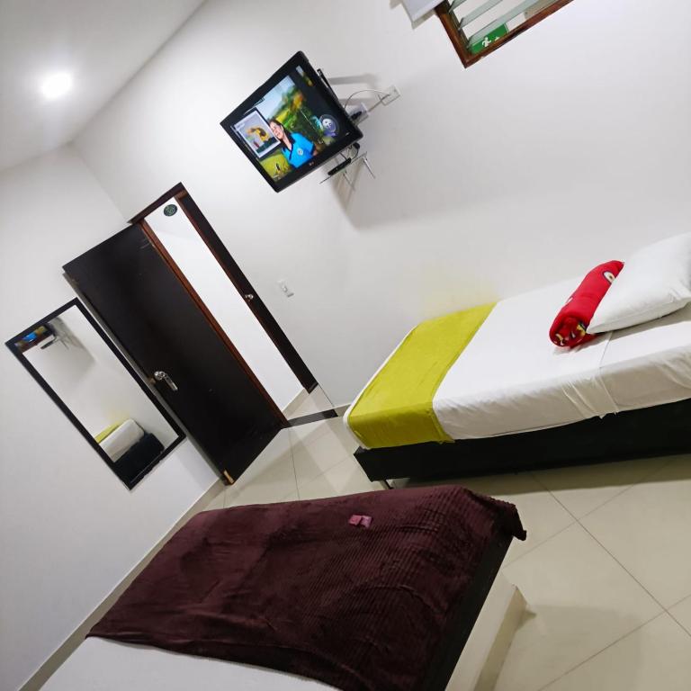 TV a/nebo společenská místnost v ubytování Hotel Laureles Park