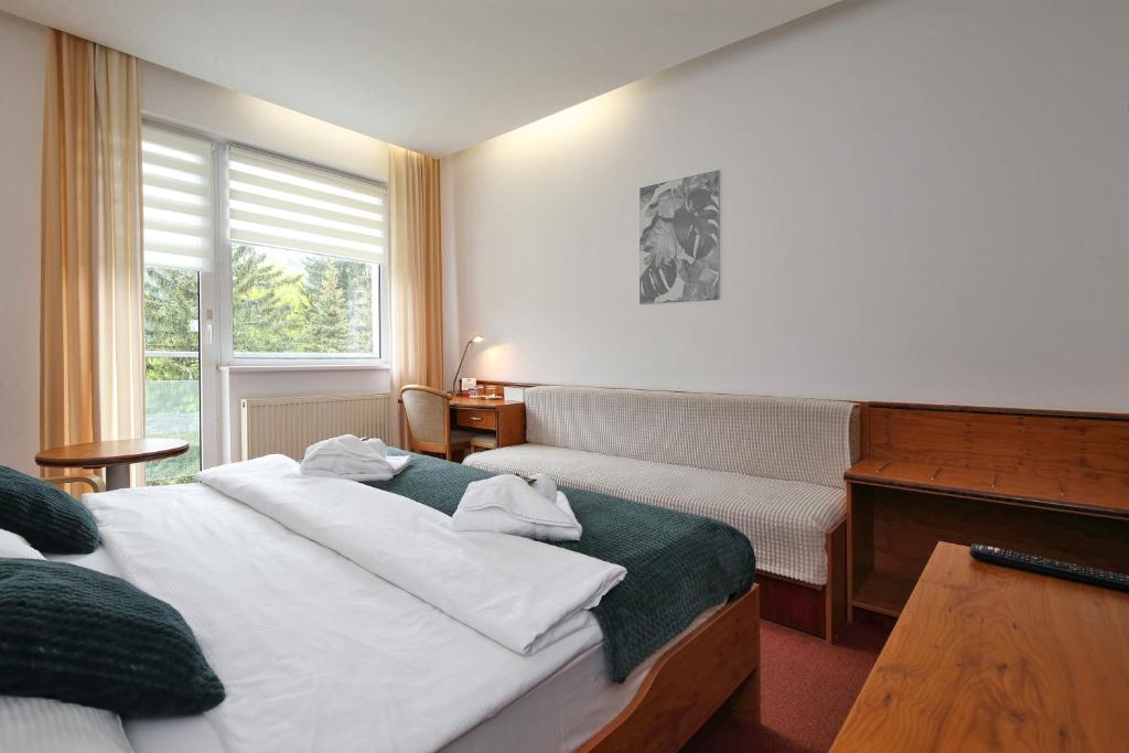 Postel nebo postele na pokoji v ubytování Interhotel Montana