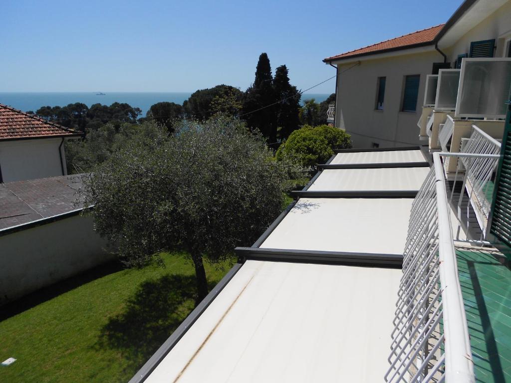 a row of white roofs on top of a house at Albergo Blueline in Tellaro