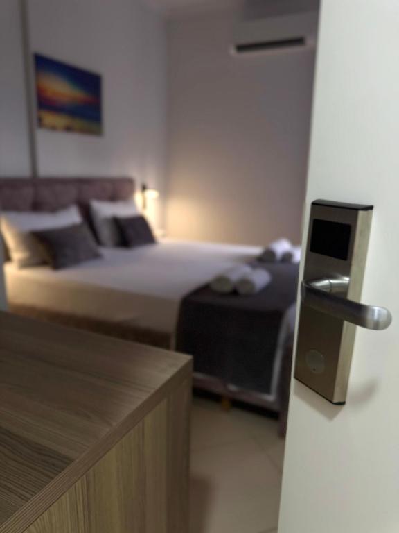 Postel nebo postele na pokoji v ubytování Hotel Abedini