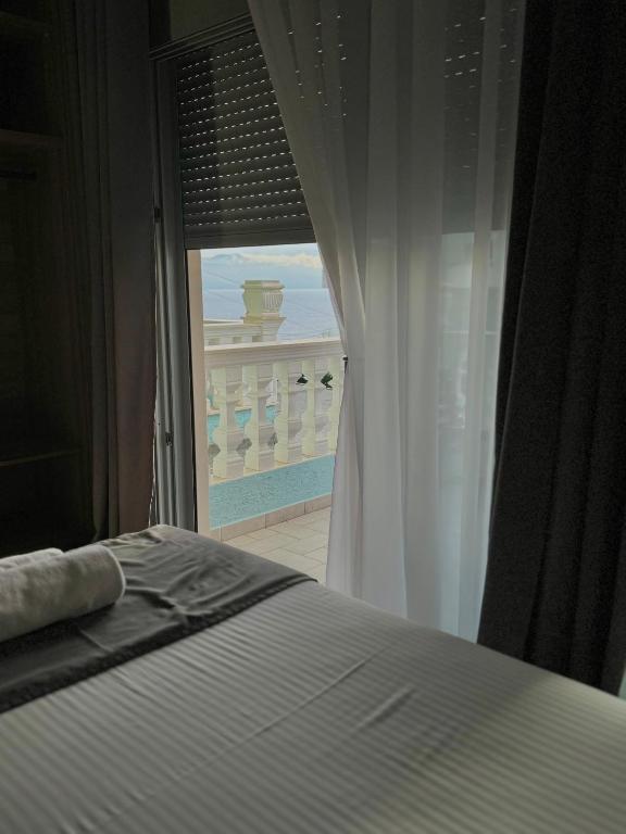 Postel nebo postele na pokoji v ubytování Hotel Abedini