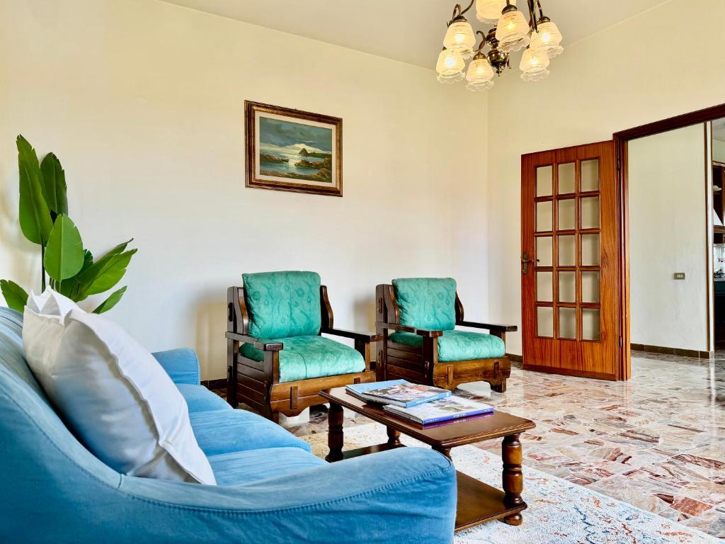 a living room with a couch and two chairs at Tuscan farmhouse - Pisa, Lucca e Firenze Rock in Bientina