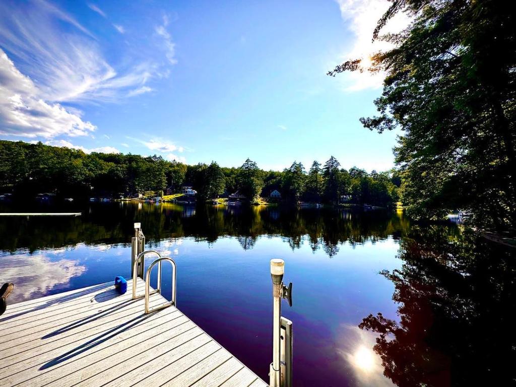 a view of a lake with a dock at Lakefront Home-Stunning Views-Hot Tub, 3100 sqft! in Wakefield