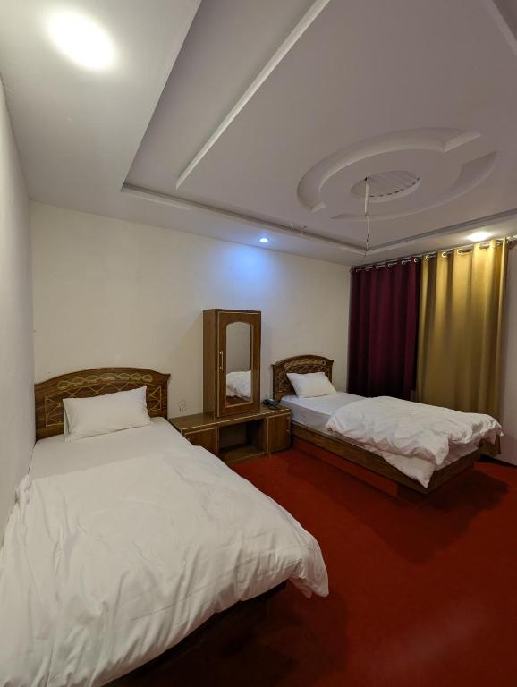 Postel nebo postele na pokoji v ubytování ReeChan Resort Skardu