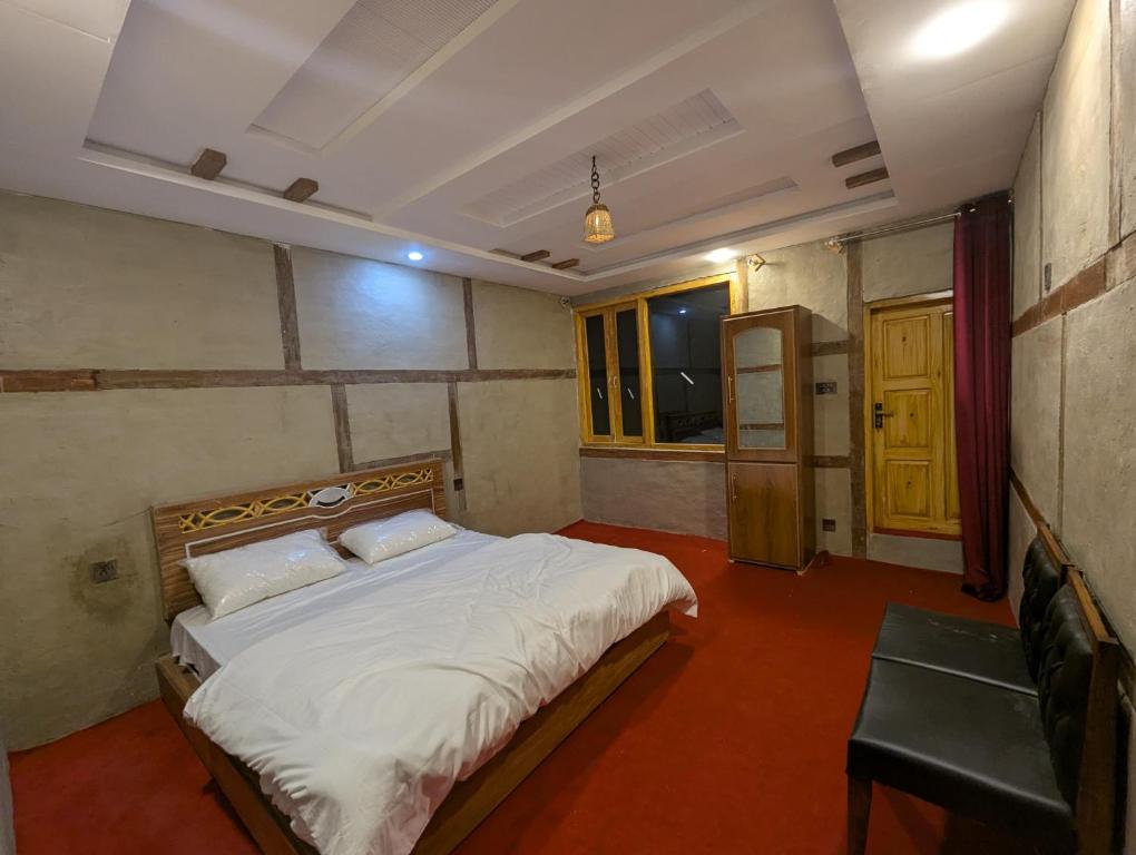 Postel nebo postele na pokoji v ubytování ReeChan Resort Skardu