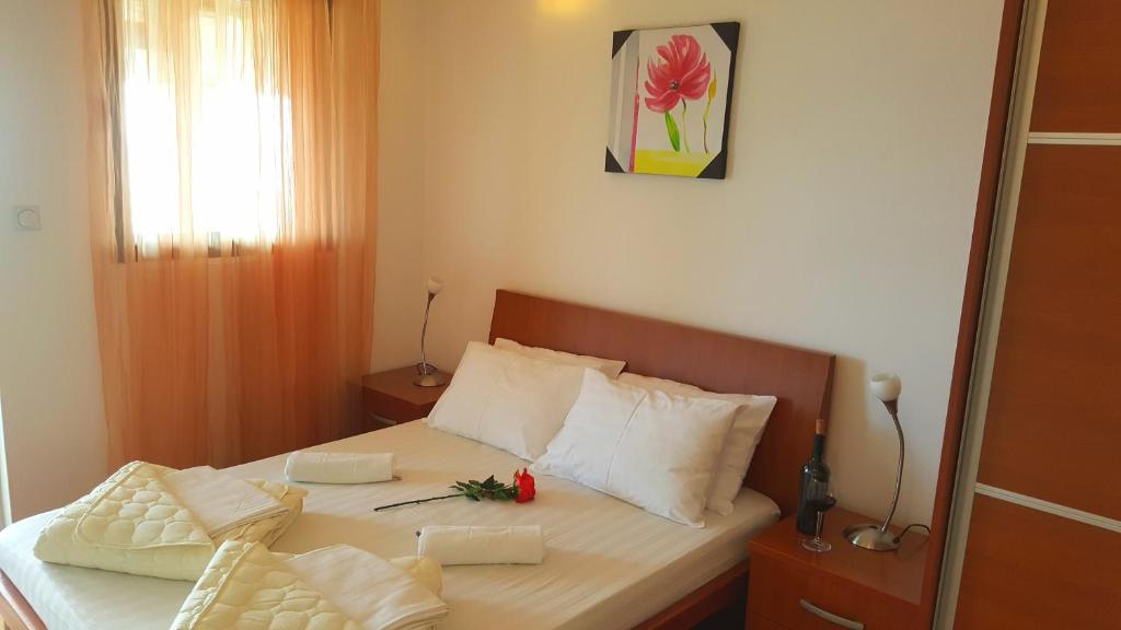 Postel nebo postele na pokoji v ubytování Apartments Rino Lux