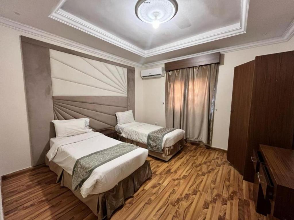 Postel nebo postele na pokoji v ubytování شقق السلامة العائلية - Al Salamh Family Apartments