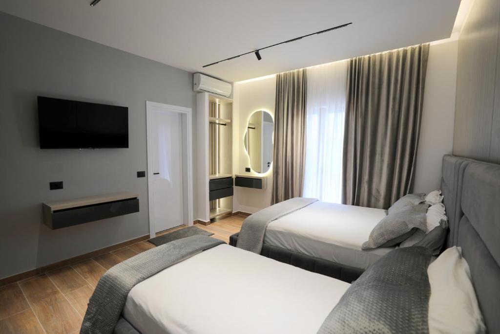 Postel nebo postele na pokoji v ubytování Apartments Romario