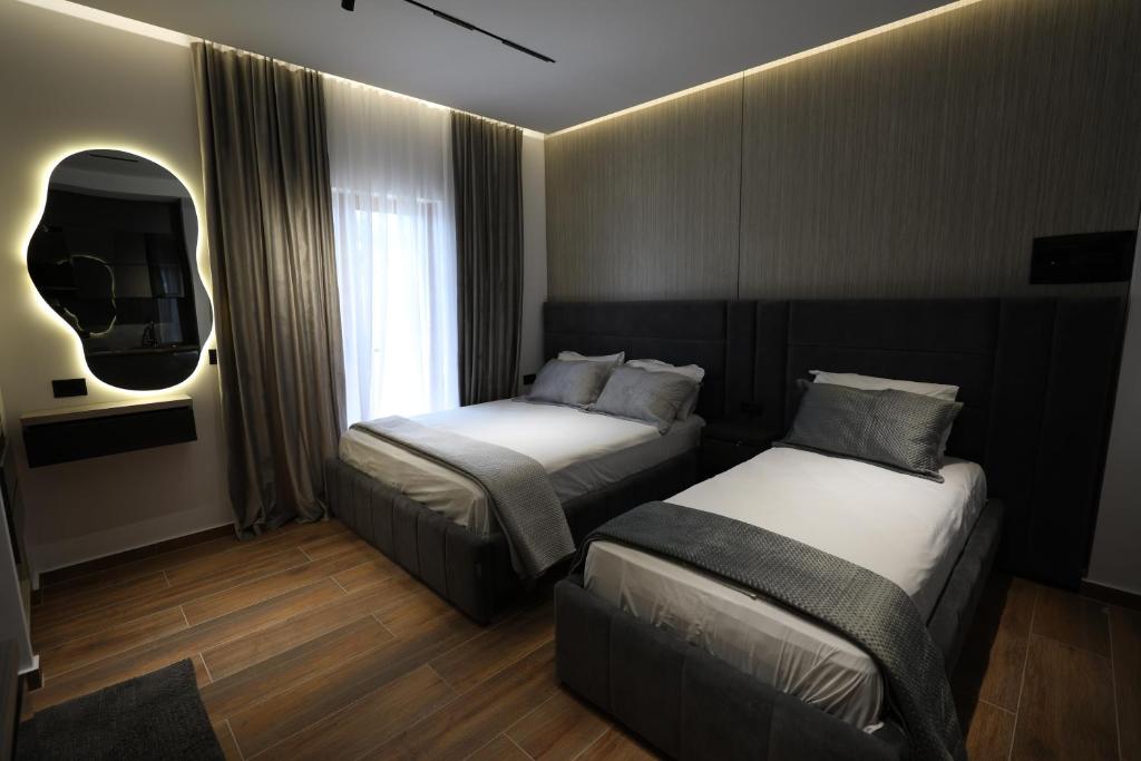 Postel nebo postele na pokoji v ubytování Apartments Romario