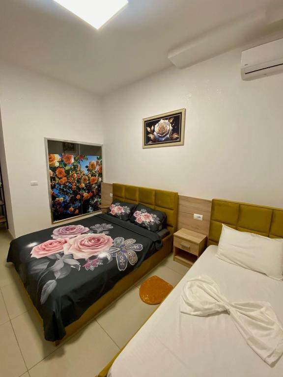 Postel nebo postele na pokoji v ubytování AA Boutique Hotel