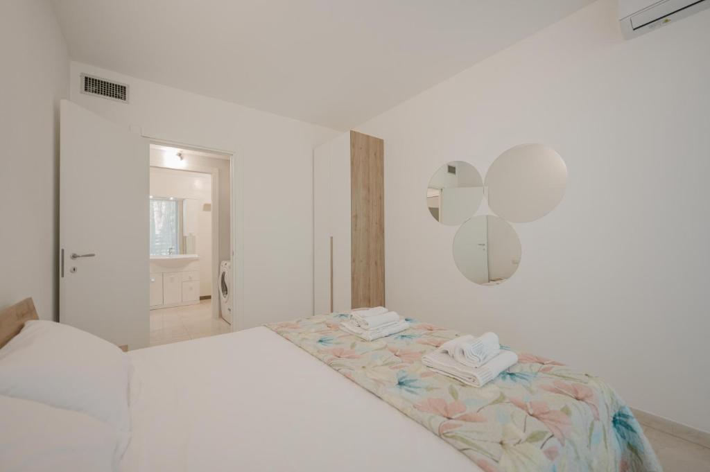 Postel nebo postele na pokoji v ubytování Vacanze Residence Mimose