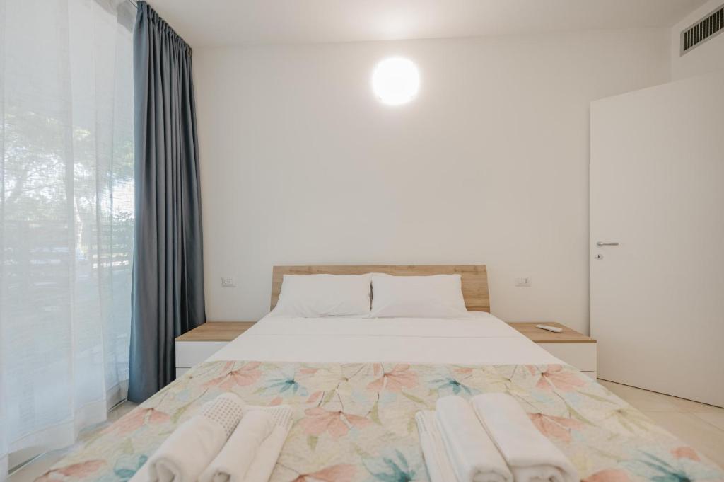 Postel nebo postele na pokoji v ubytování Vacanze Residence Mimose