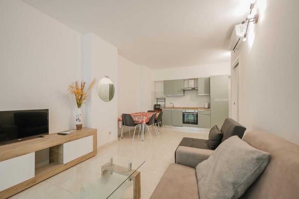 TV a/nebo společenská místnost v ubytování Vacanze Residence Mimose