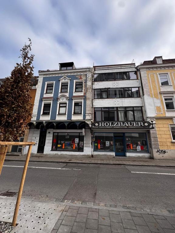 a building on the side of a street at Stadt Apartments Bade in Rosenheim