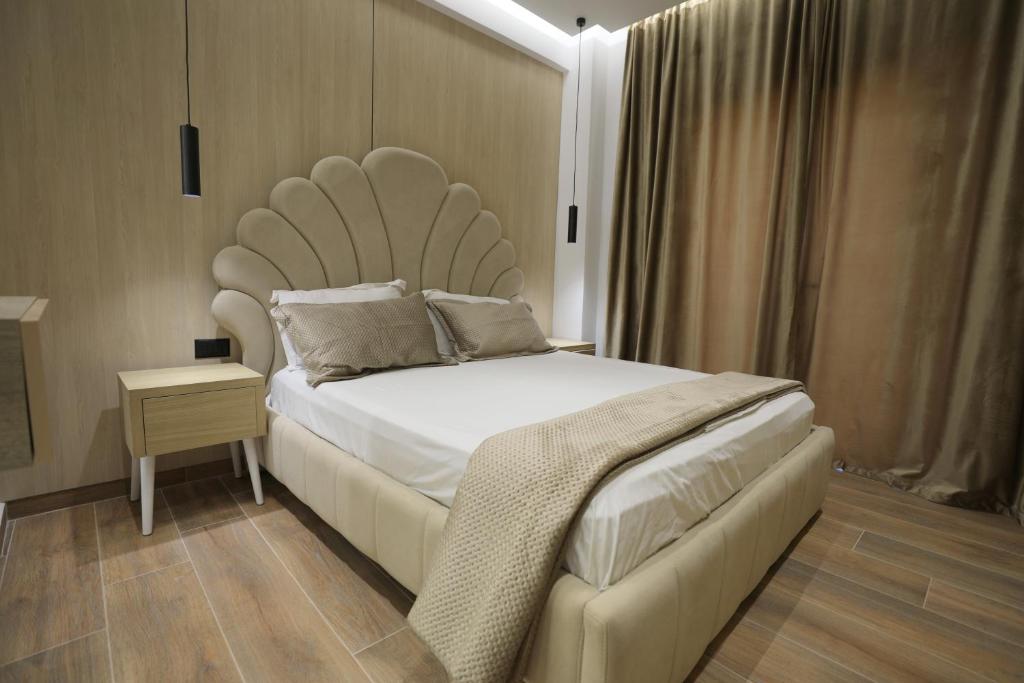 Postel nebo postele na pokoji v ubytování Apartments Romario