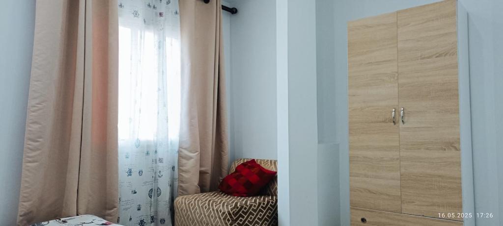 a room with a closet with a curtain and a window at TIM Haute standing appartment S2, center Monastir in Monastir