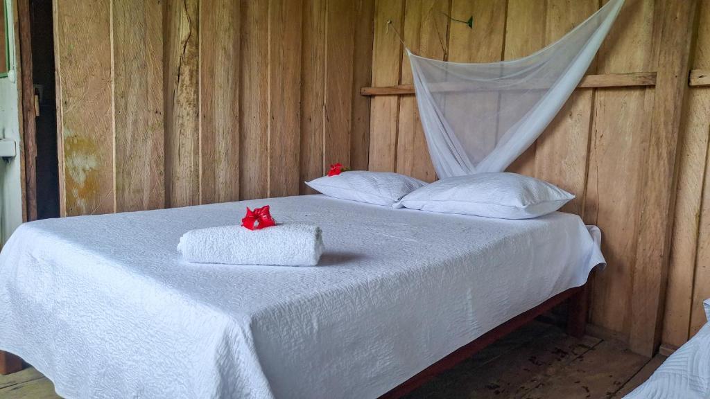 Postel nebo postele na pokoji v ubytování Ecoposada Nore