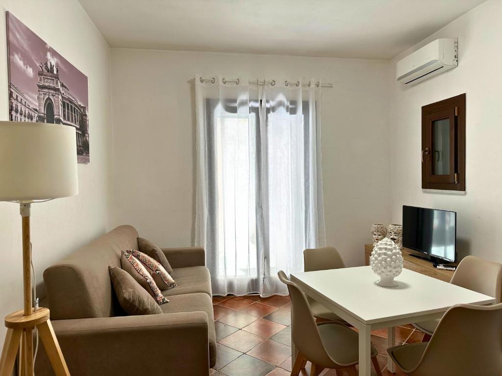 Televízia a/alebo spoločenská miestnosť v ubytovaní Appartamenti-Residence Al Massimo