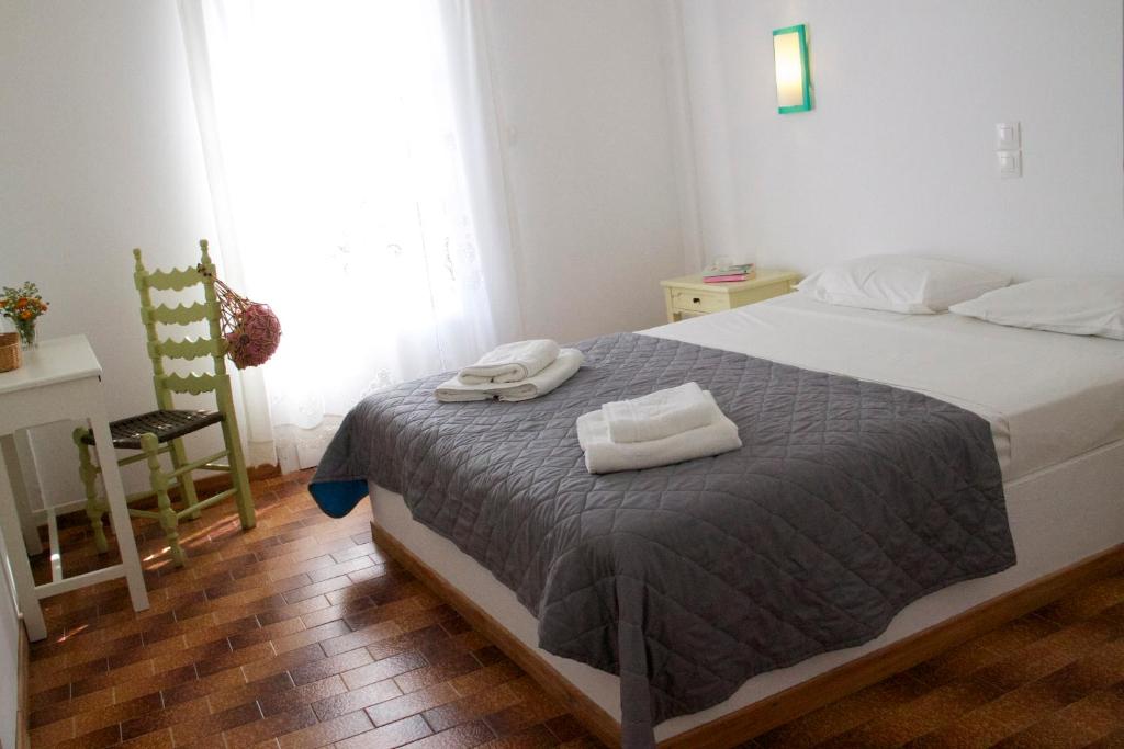 Postel nebo postele na pokoji v ubytování Arokaria Seaside