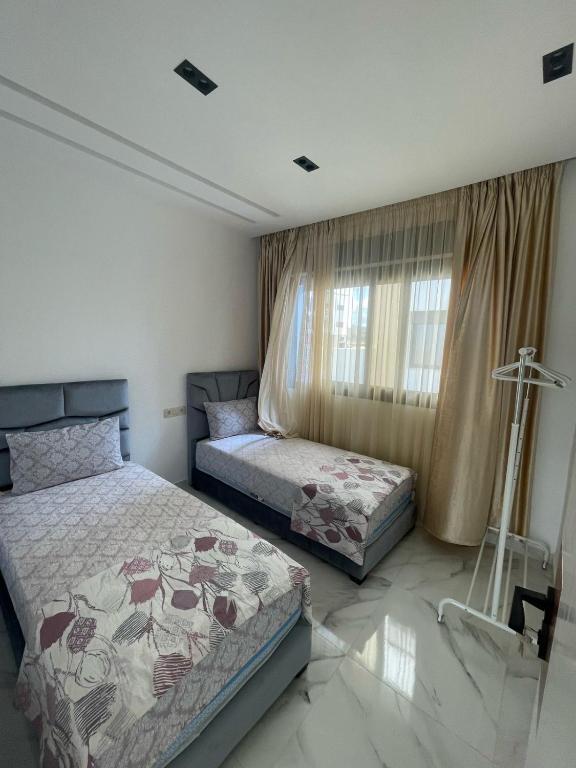 Postel nebo postele na pokoji v ubytování Oumaira Residence Azla-Tetouan