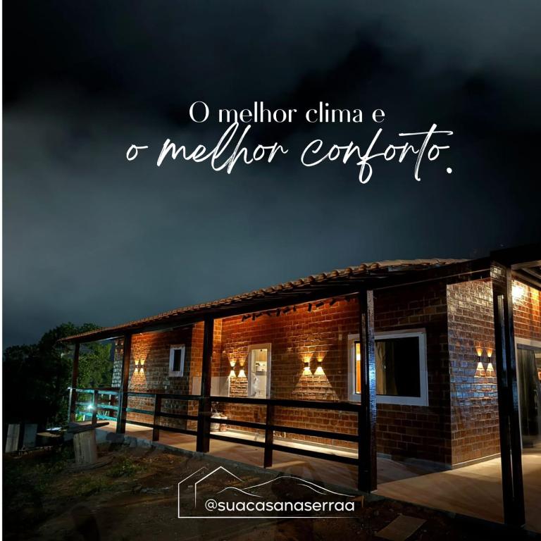 a brick house with the words molecular china a mother center at Sua casa na serra in Bezerros