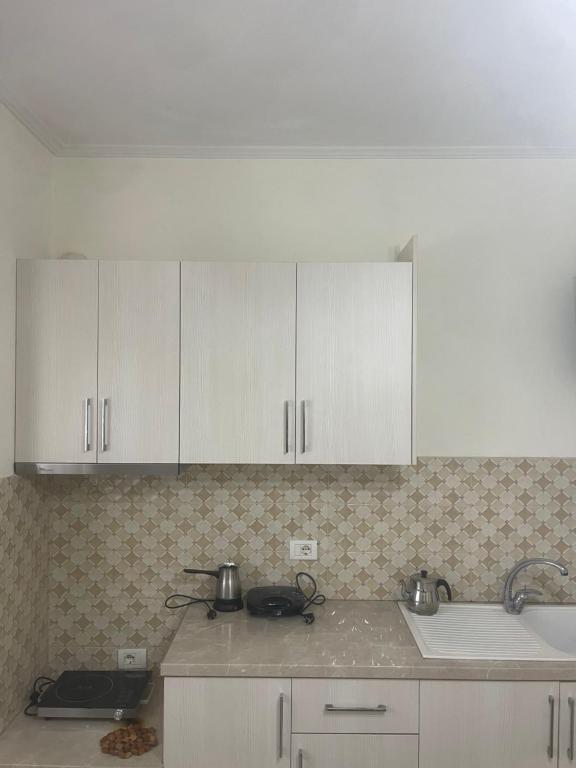 Kuchyň nebo kuchyňský kout v ubytování Apartments Romario
