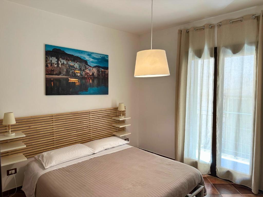 Posteľ alebo postele v izbe v ubytovaní Appartamenti-Residence Al Massimo