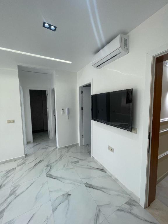 TV a/nebo společenská místnost v ubytování Oumaira Residence Azla-Tetouan
