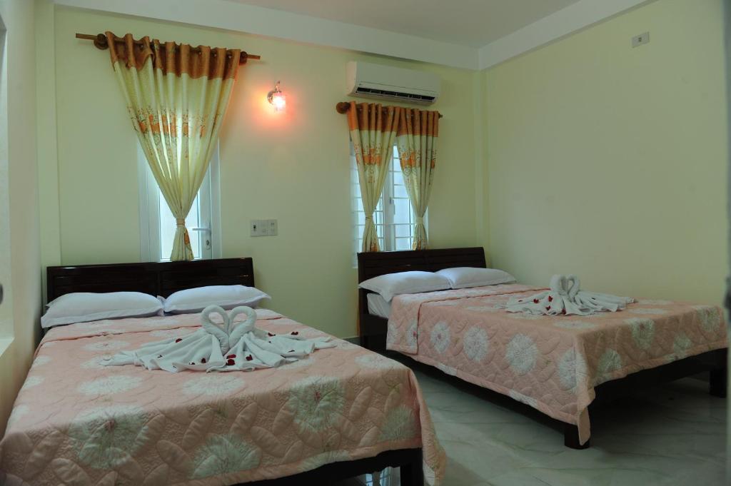 Postel nebo postele na pokoji v ubytování Thanh An 3 Guesthouse