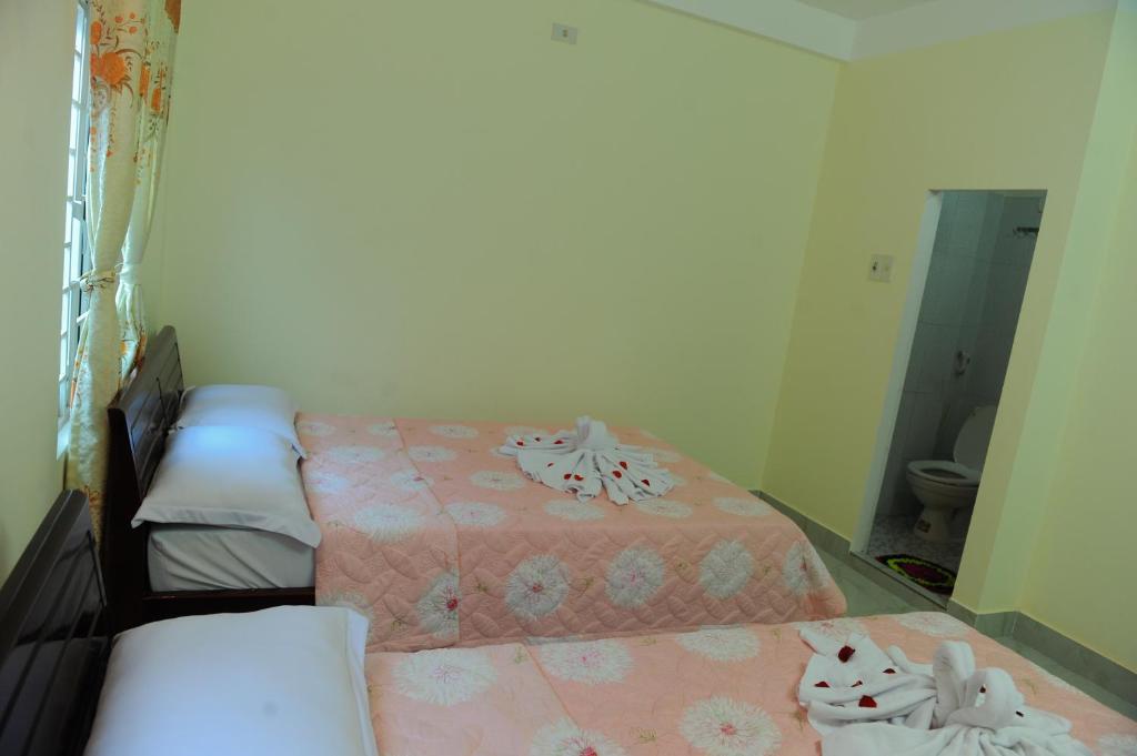 Postel nebo postele na pokoji v ubytování Thanh An 3 Guesthouse