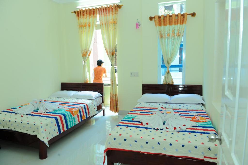 Postel nebo postele na pokoji v ubytování Thanh An 3 Guesthouse