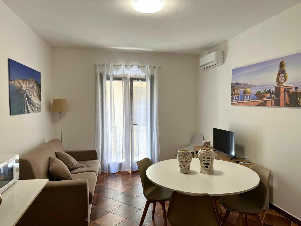 Televízia a/alebo spoločenská miestnosť v ubytovaní Appartamenti-Residence Al Massimo