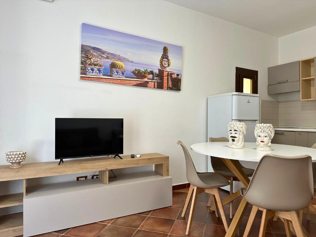 Televízia a/alebo spoločenská miestnosť v ubytovaní Appartamenti-Residence Al Massimo