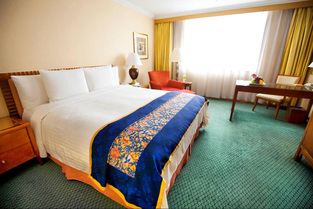 Postel nebo postele na pokoji v ubytování Courtyard By Marriott Shanghai Pudong