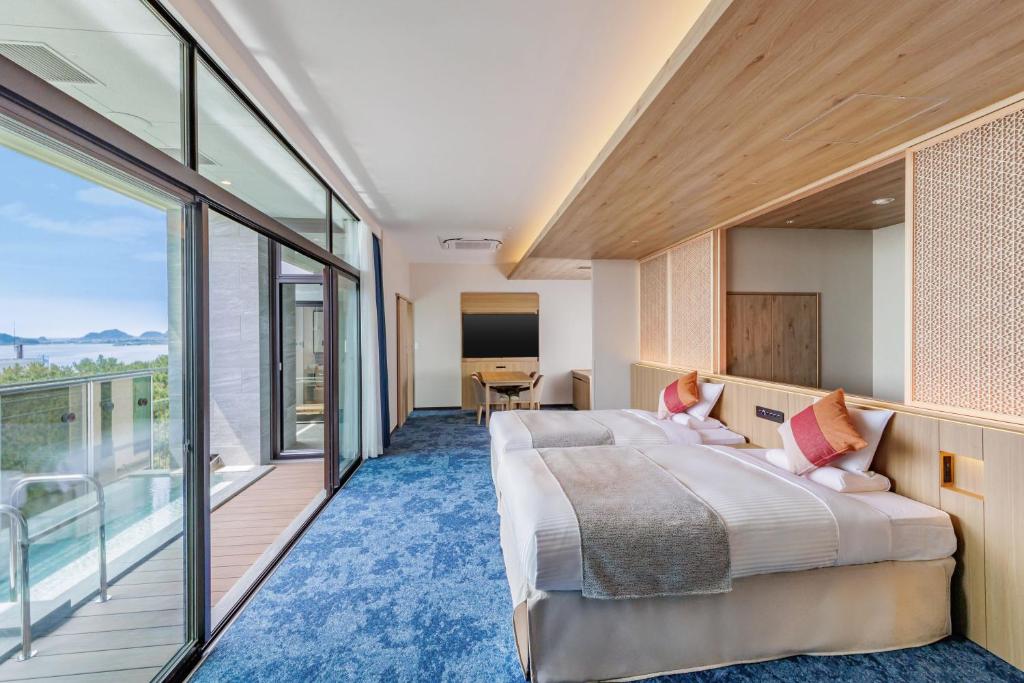 Postel nebo postele na pokoji v ubytování KAMENOI HOTEL Kamogawa