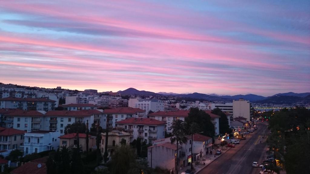 a view of a city at sunset at Nice Promenade des Anglais in Nice