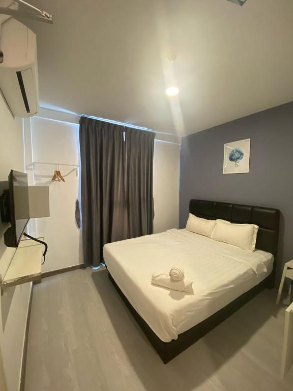 Postel nebo postele na pokoji v ubytování Havona hotel - Taman Tropika Kulai