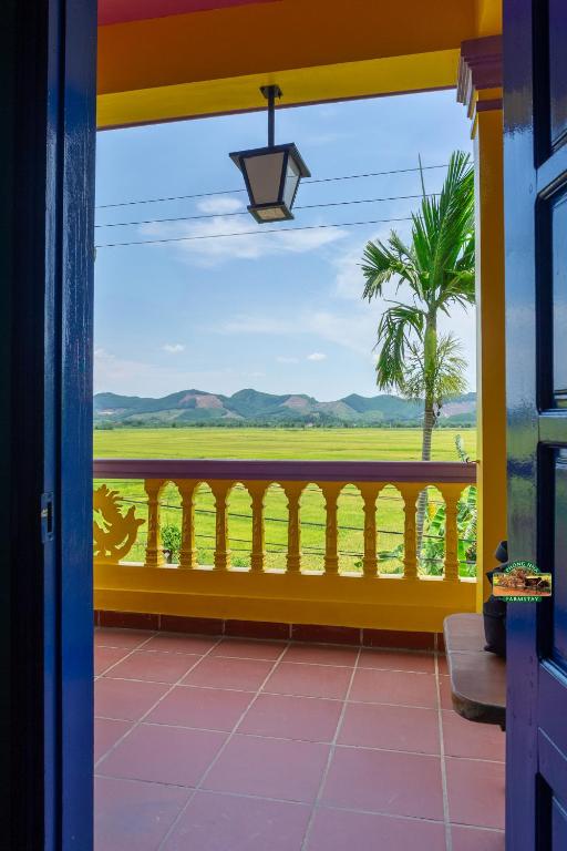 Balkón nebo terasa v ubytování Phong Nha Farmstay