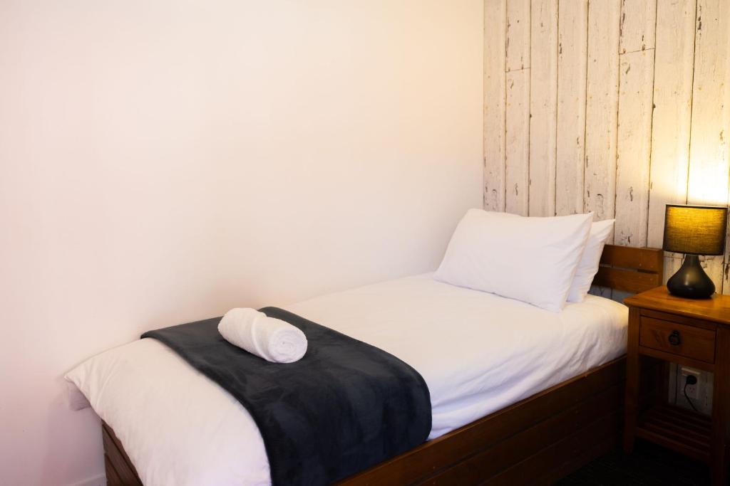 Postel nebo postele na pokoji v ubytování Haka House Taupo
