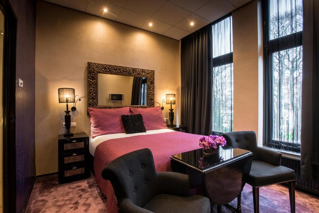 Postel nebo postele na pokoji v ubytování Hotel Sebastians