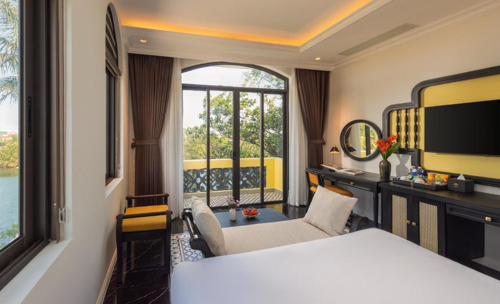 TV a/nebo společenská místnost v ubytování Nesta Hoian Resort & Spa
