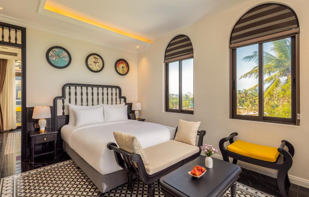 Postel nebo postele na pokoji v ubytování Nesta Hoian Resort & Spa